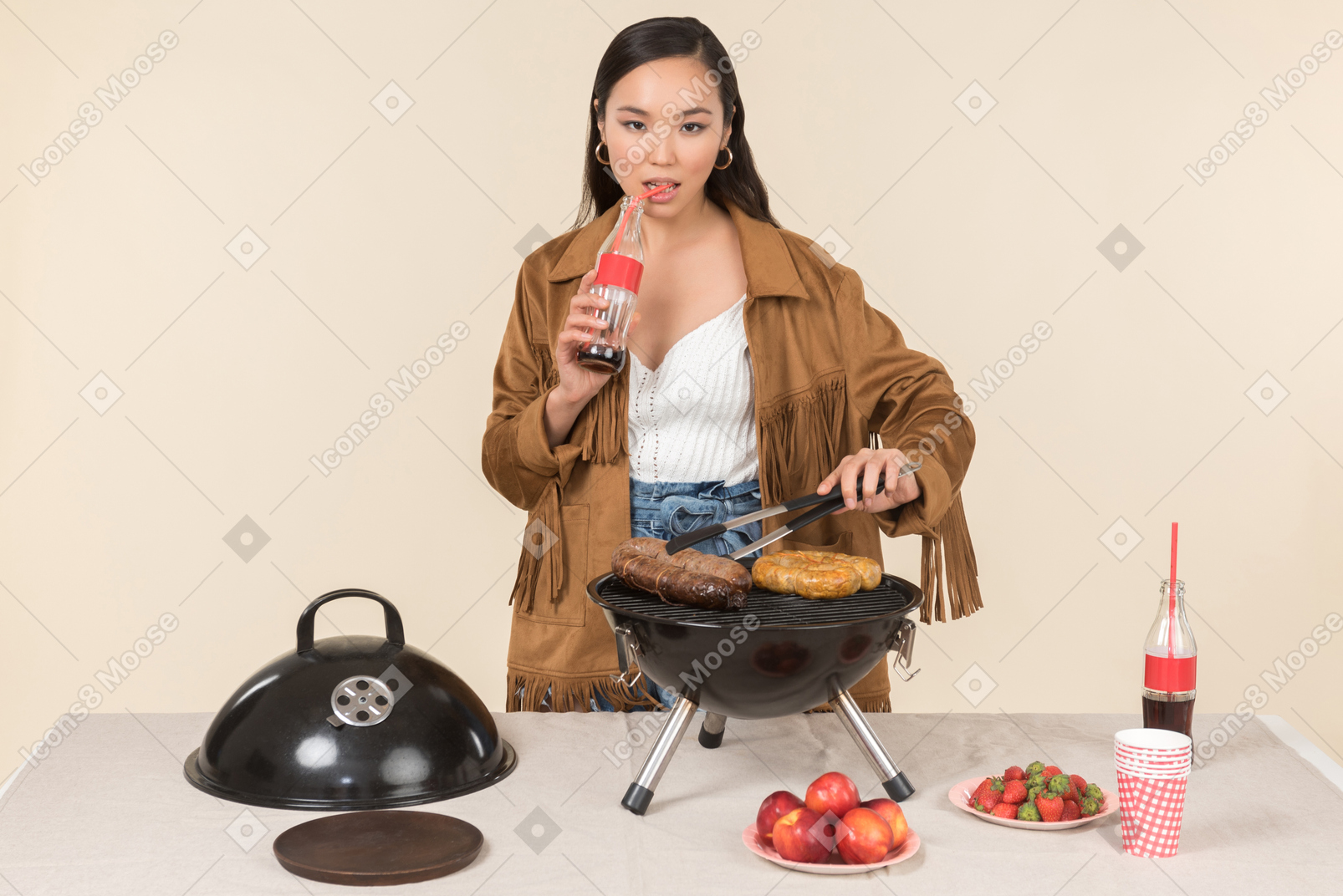 Young asian woman preparing bbq and drinking coke