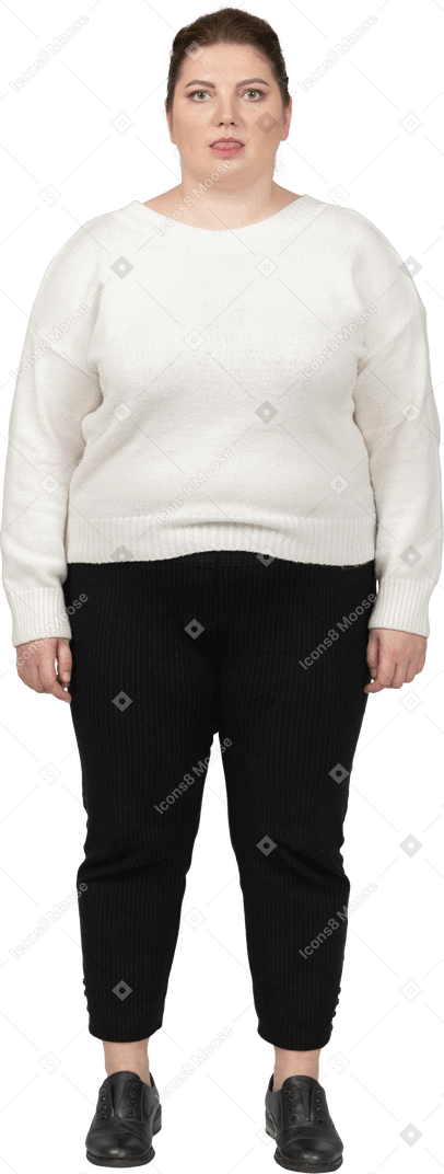Plump woman in casual clothes showing tongue