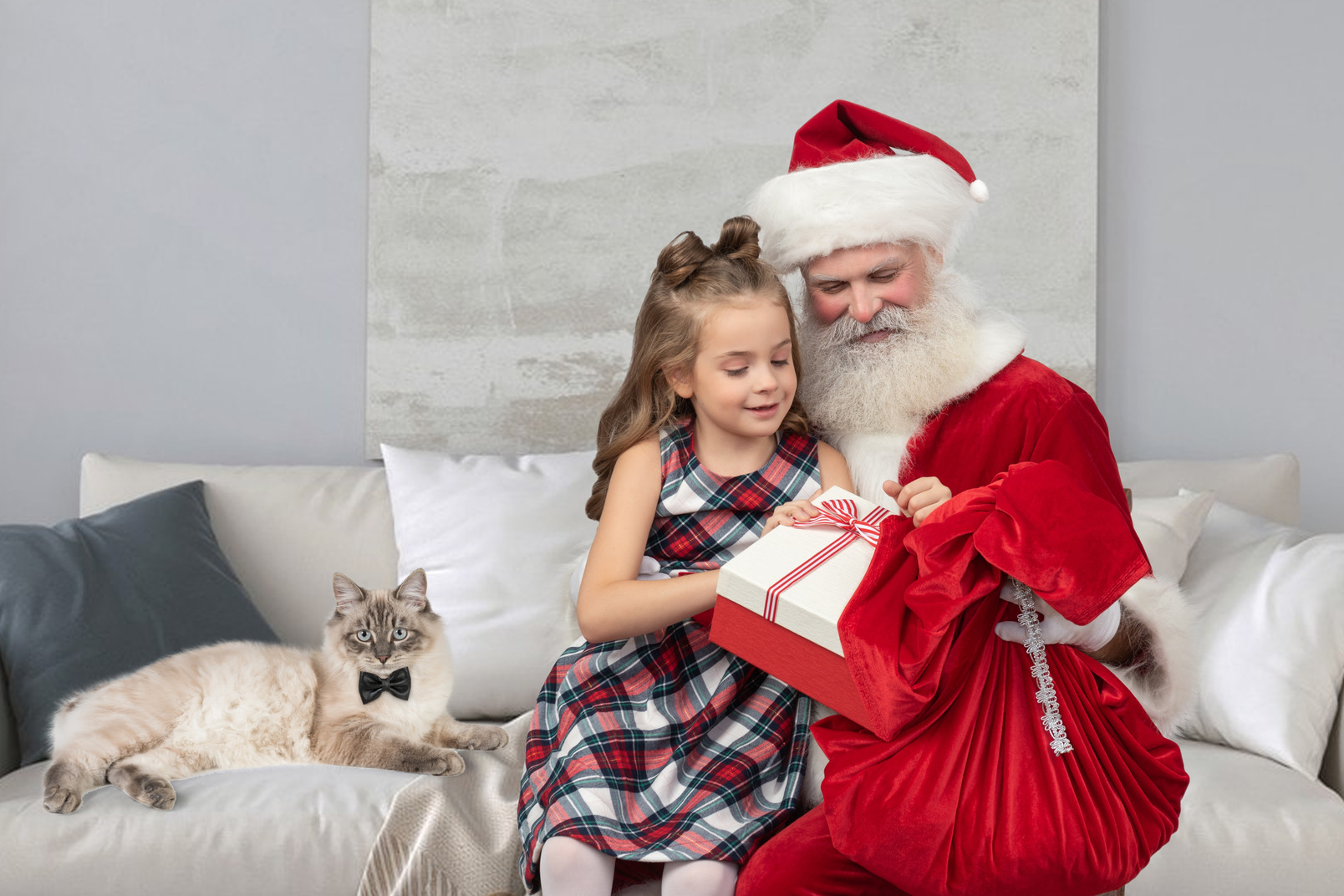 Little girl on santa's knees getting her presents