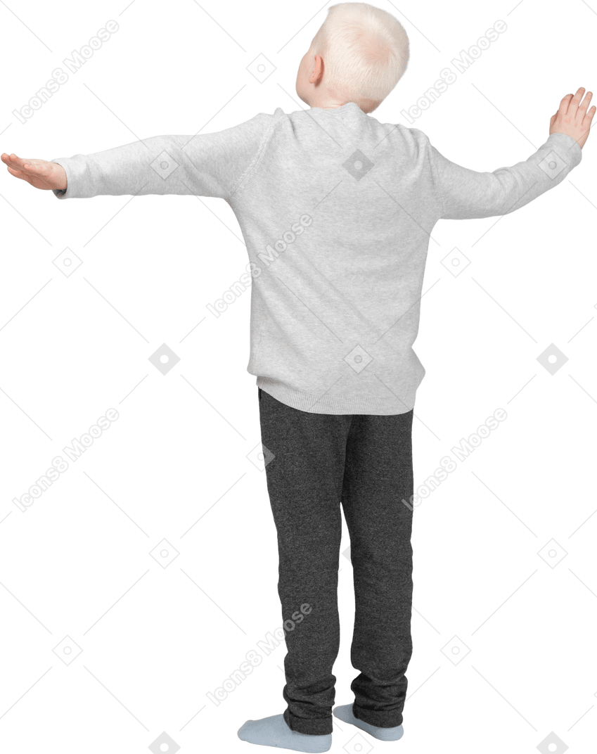 Vista traseira de três quartos de um menino esticando os braços para o lado