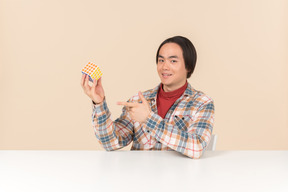 An asian geek guy in a checkered shirt