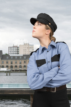 Policewoman in uniform looking away