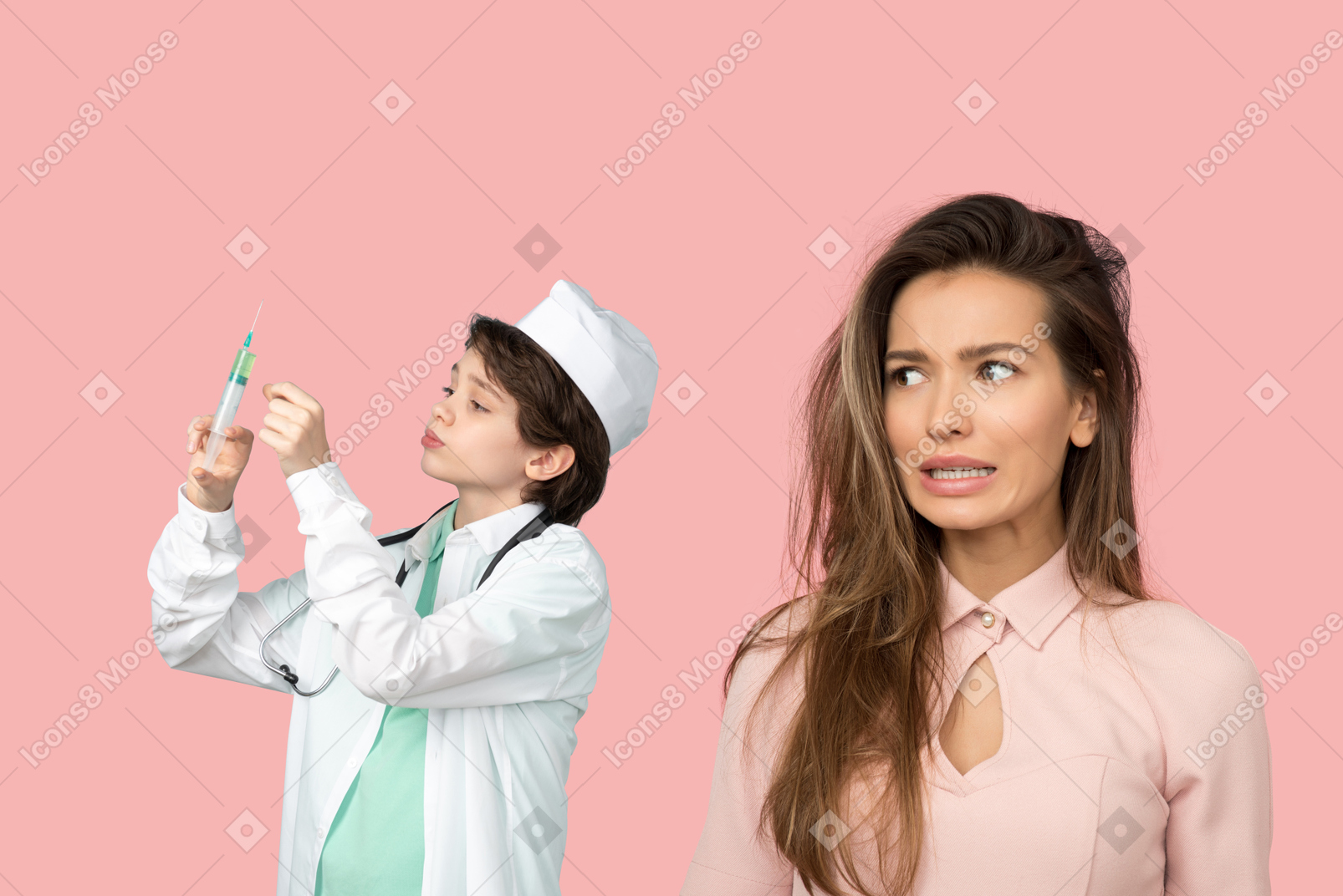 Attractive woman terrified of a kid doctor preparing an injection