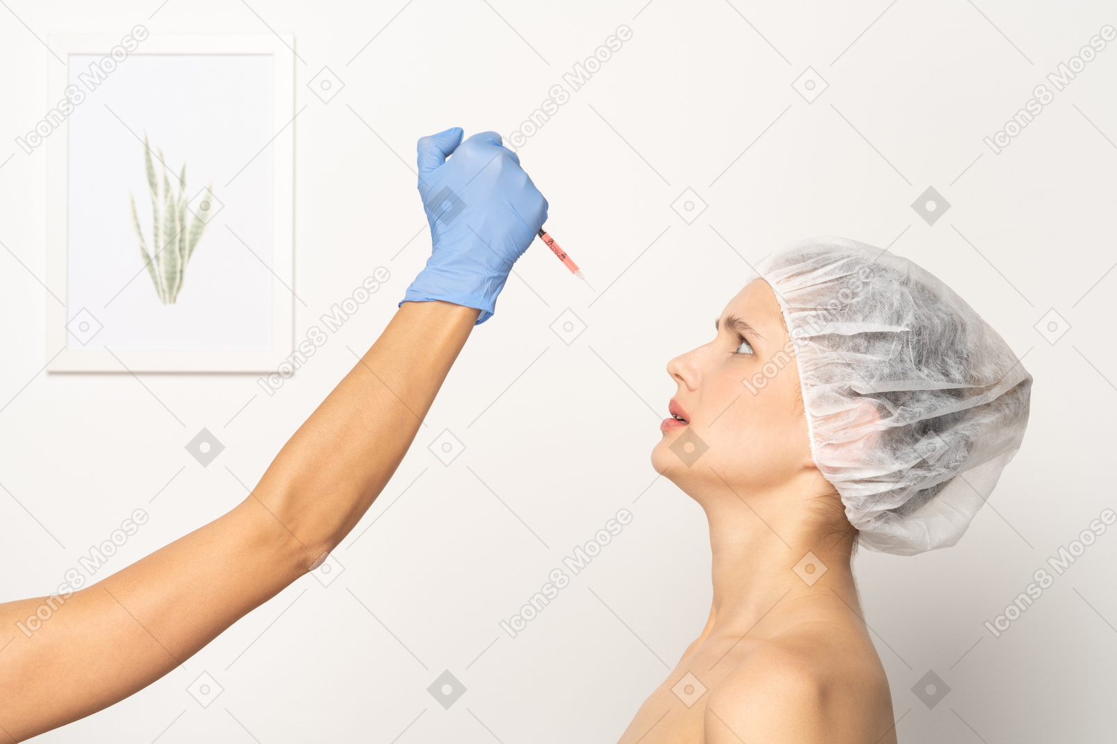 Side view of a woman looking nervously at syringe