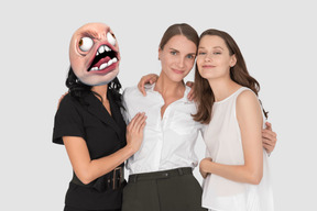Women posing with one woman with rage guy meme on her face