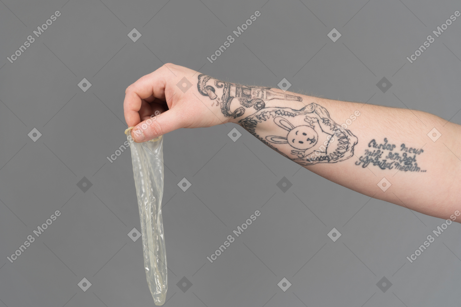 Holding a used condom