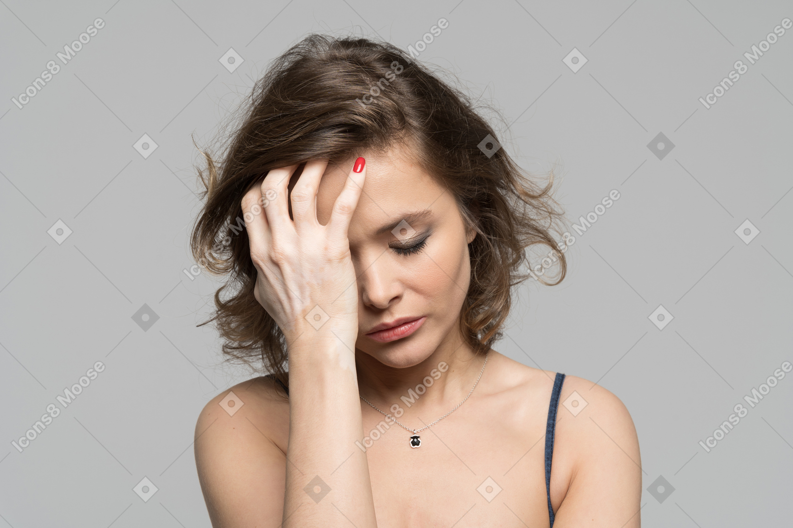 Depressed woman leaning on her hand