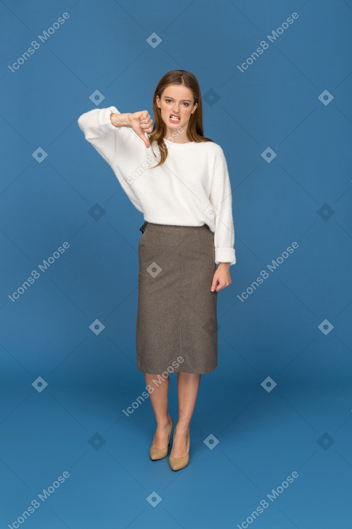 Young businesswoman giving the thumbs down