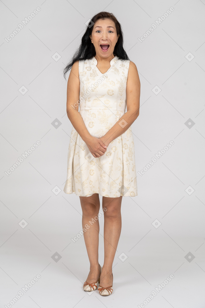 Woman in a white dress standing