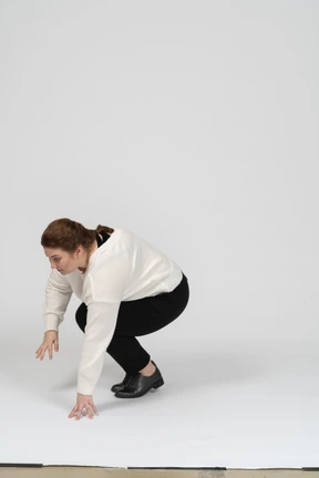 Side view of a plus size woman in casual clothes falling