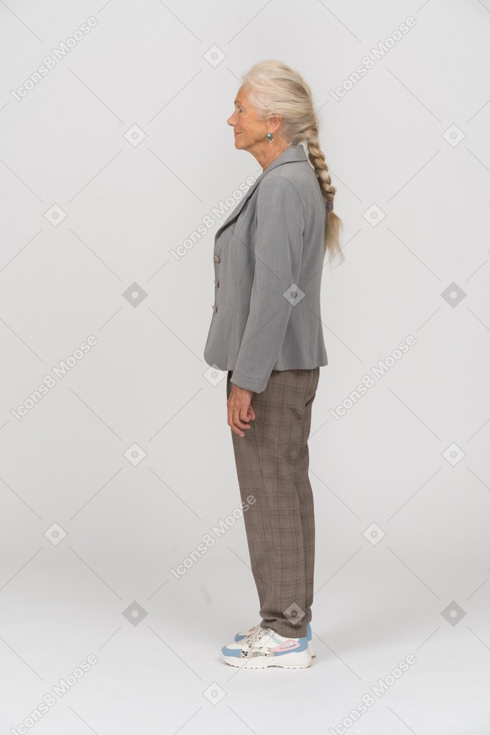 Side view of an old lady in grey jacket