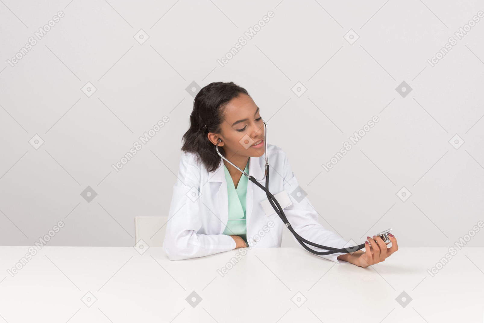 Beautiful female doctor with the stethoscope