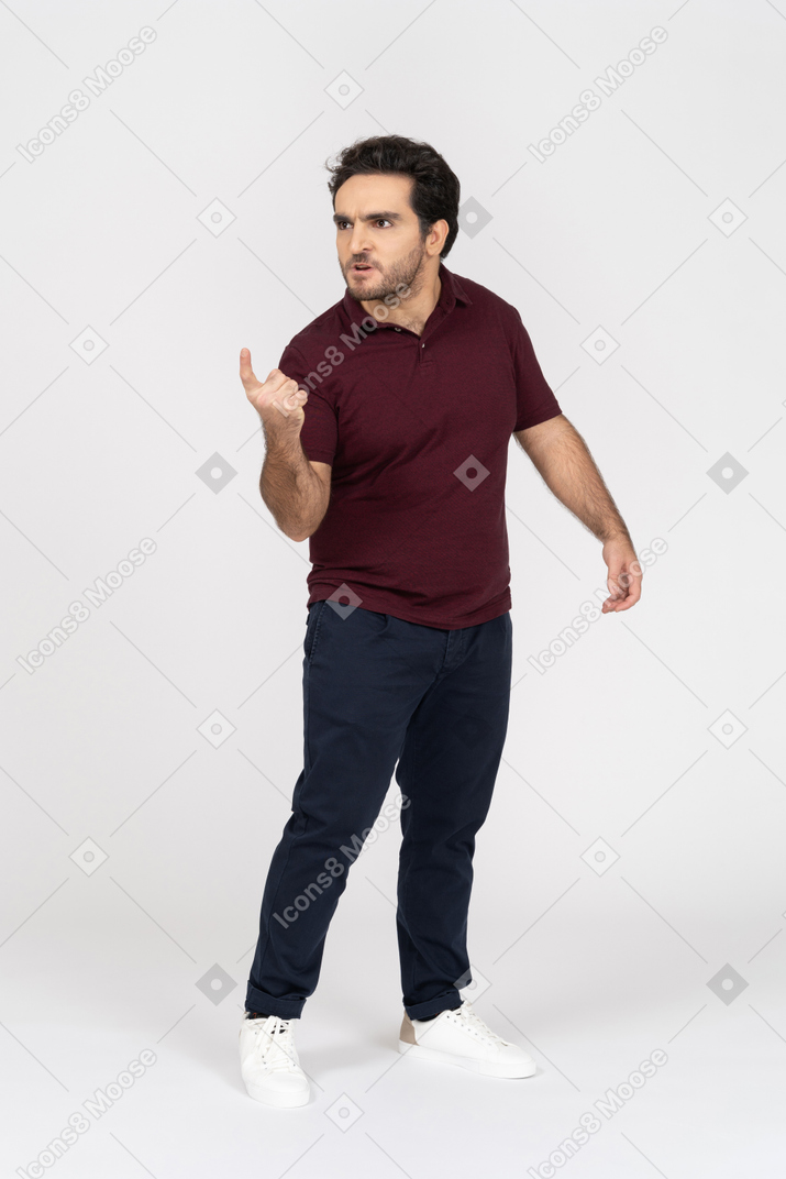 Man looking away and pointing with index finger