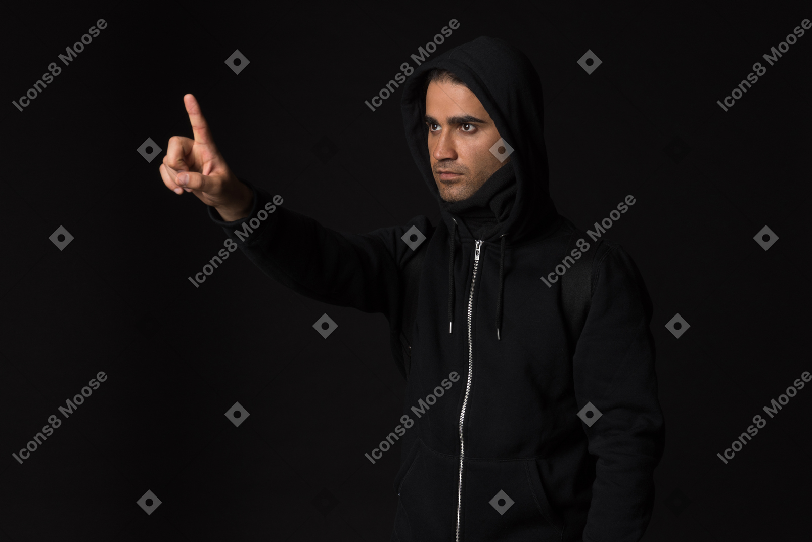 Hacker guy standing into dark and like touching something with a finger