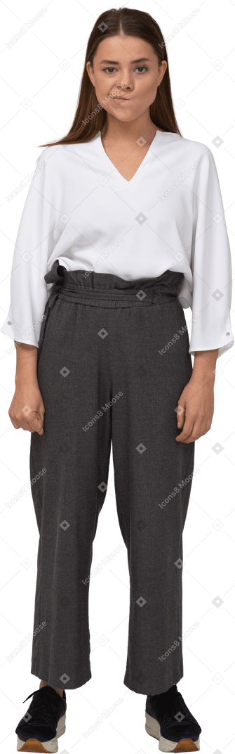 Front view of a smirking young lady in office clothing
