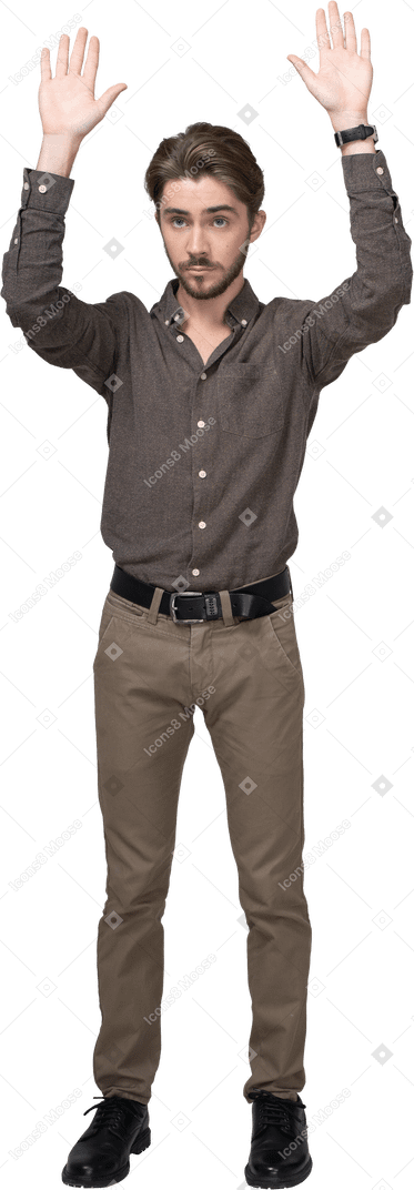 Front view of a young man in office clothing raising hands