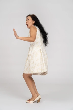 Woman in a white dress standing