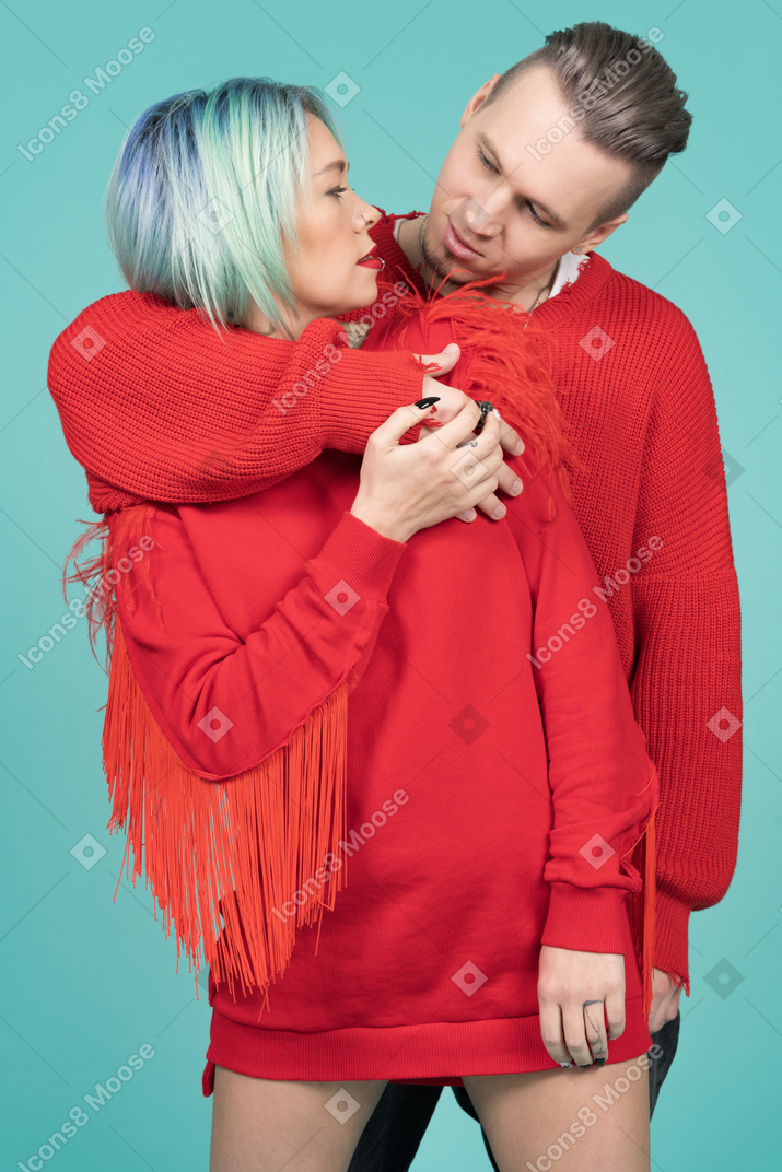 Young man and woman in love looking to each other`s eyes