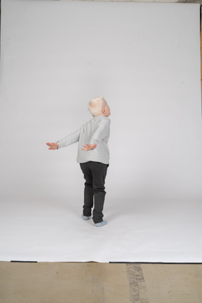 Back view of a boy about to jump