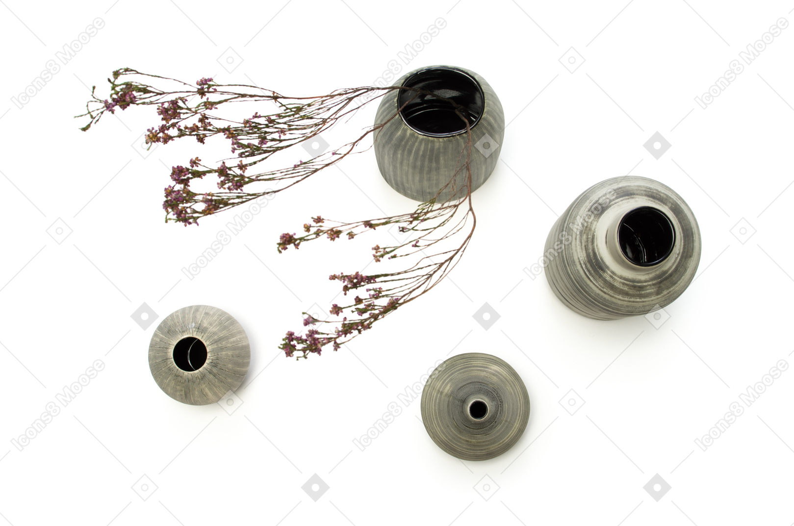 Four vases with dried flowers