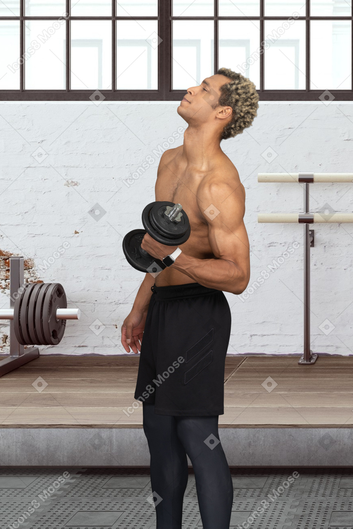 Man lifting weights in a gym