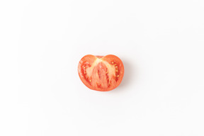 Half of tomato on white background