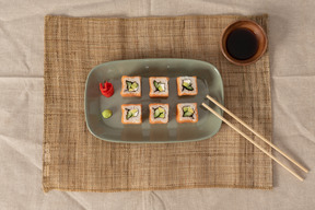 A set of sushi rolls on a platter