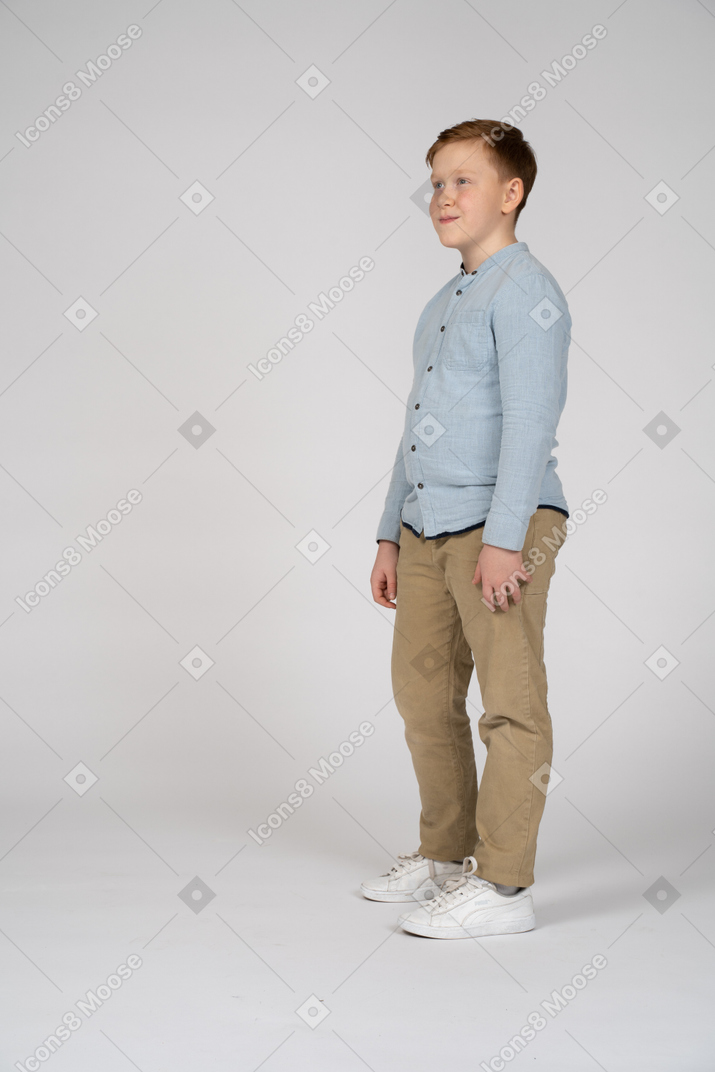 Young little boy kid wearing elegant shirt standing over pink isolated  background looking to side, relax profile pose with natural face with  confident smile. Stock Photo | Adobe Stock