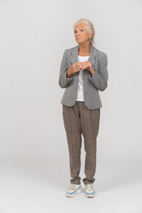 Front view of an old lady in suit