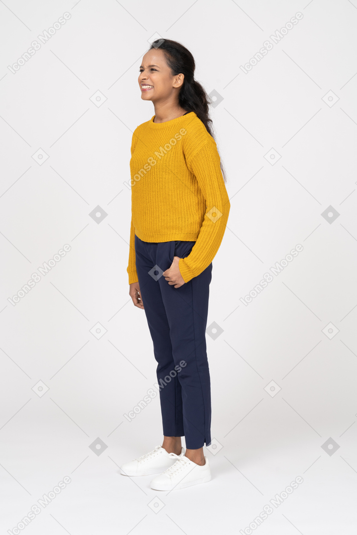 Side view of a girl in casual clothes clenching teeth