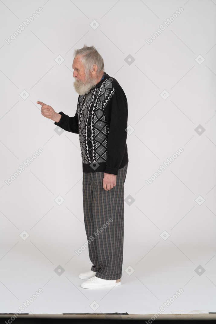 Side view of scolding with finger old man