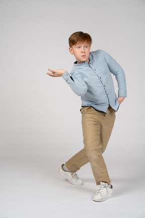 A young boy doing a pose
