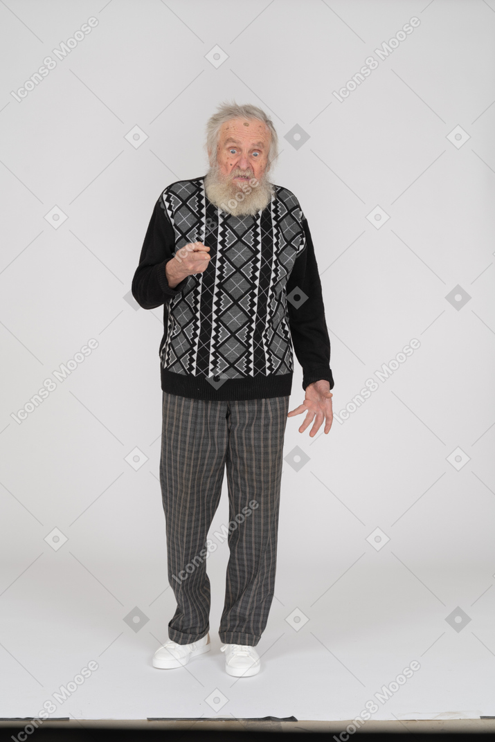 Mad old man scolding with finger