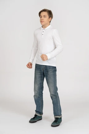 Young man in casual clothes standing