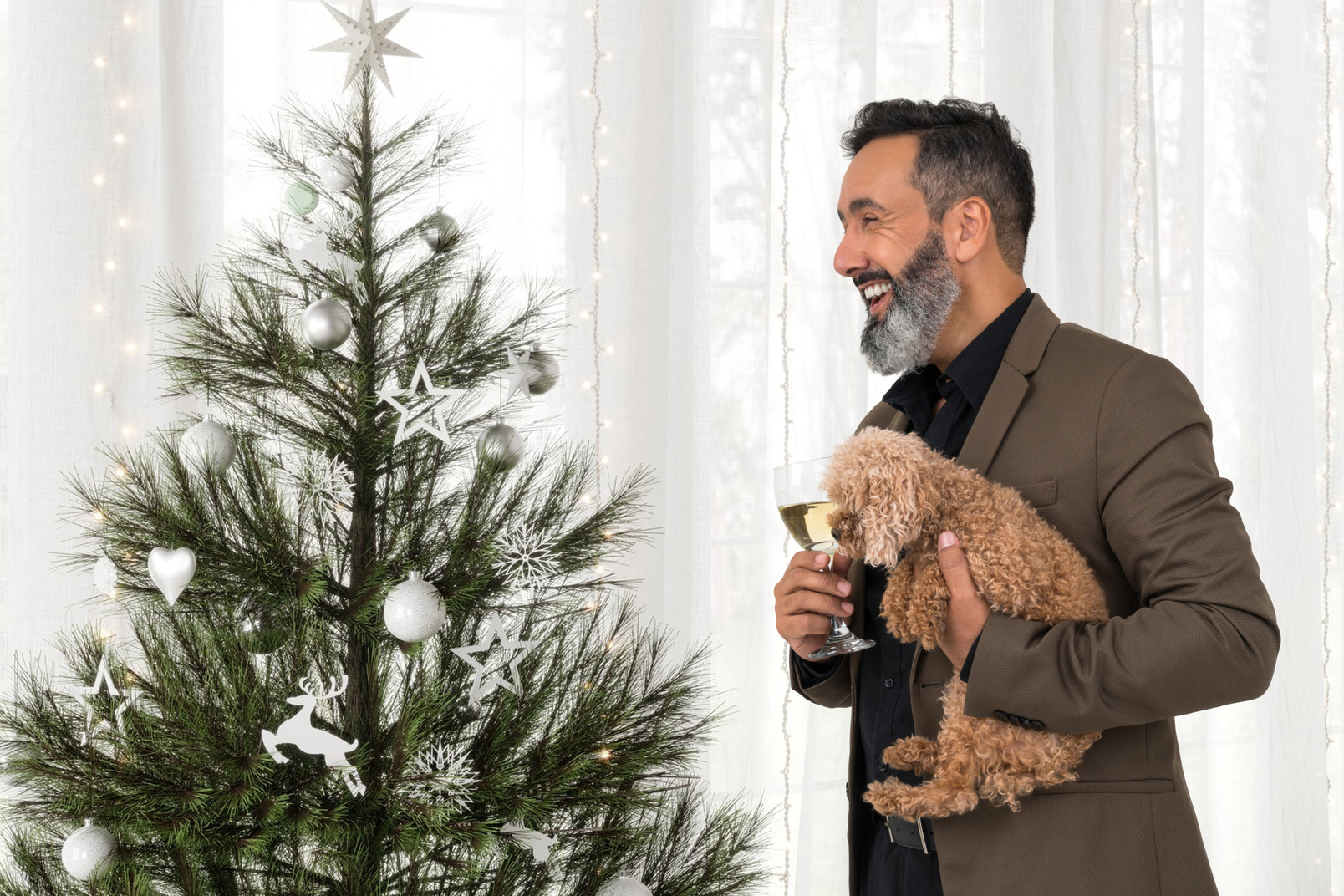 Stilish man with his dog celebrating christmas