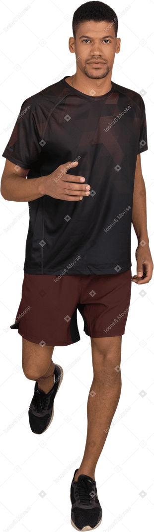 Young man in sports clothes jogging