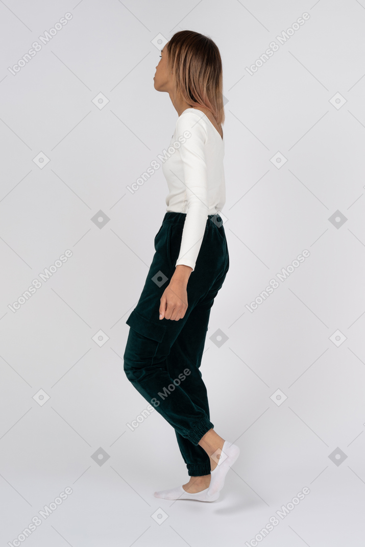 Woman in casual clothes walking