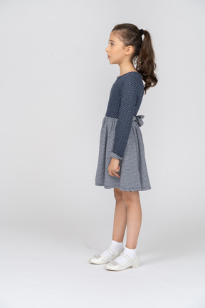 Side view of a girl standing