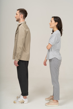Side view of young couple standing