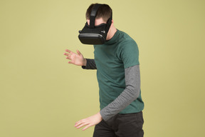 Young man using virtual reality headset