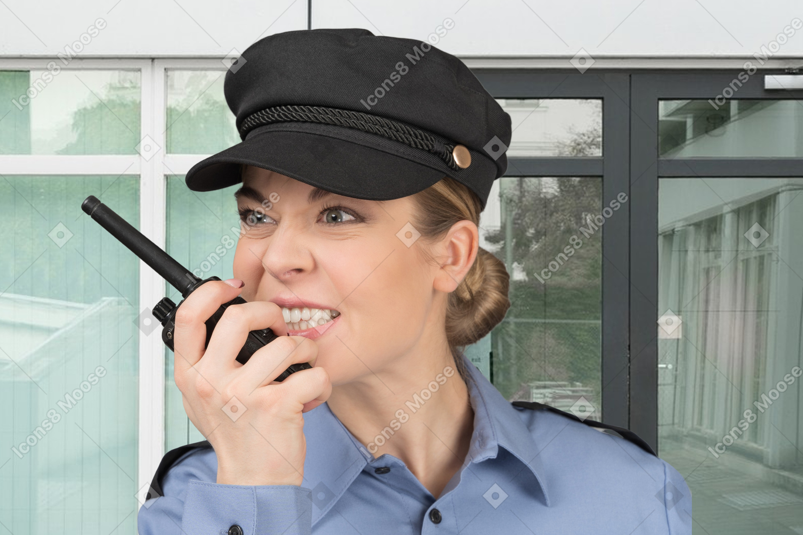 An angry policewoman talking on walkie talkie