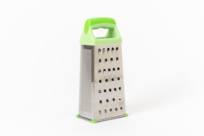 Grater with a plastic green handle