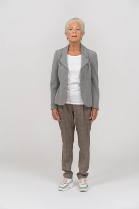 Front view of an old lady in suit looking at camera