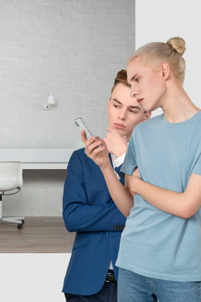 Two men looking at a cell phone