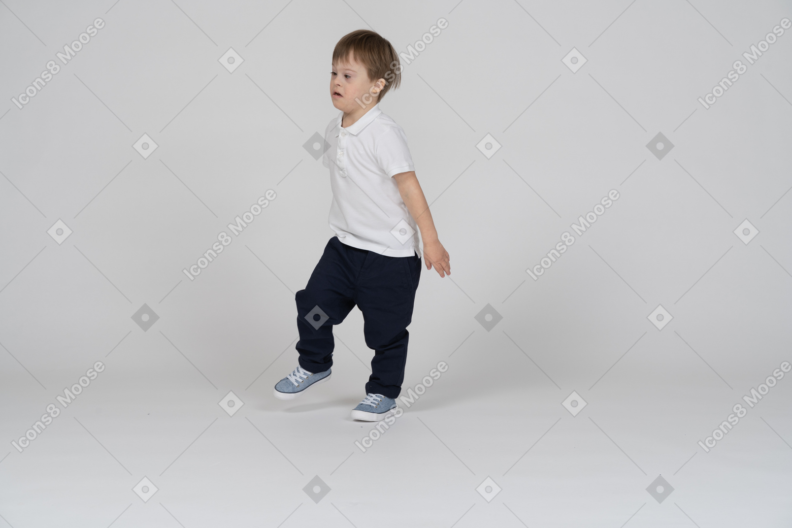 Three-quarter view of a boy stepping forward