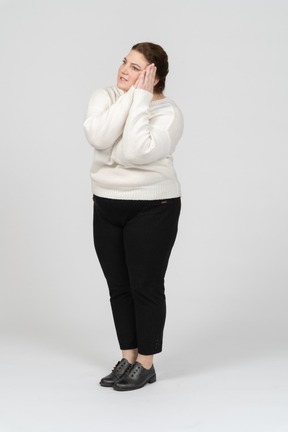 Front view of a sleepy plus size woman in casual clothes