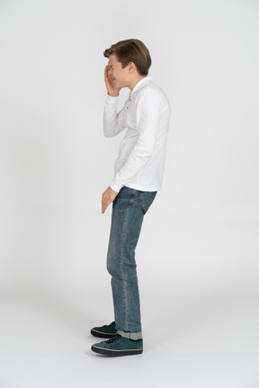 Young man in casual clothes standing