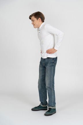 Young man in casual clothes standing