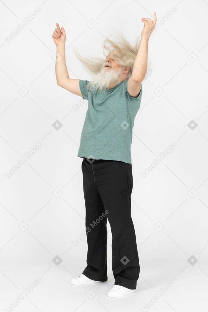 Three-quarter view of old man shaking head and raising hands