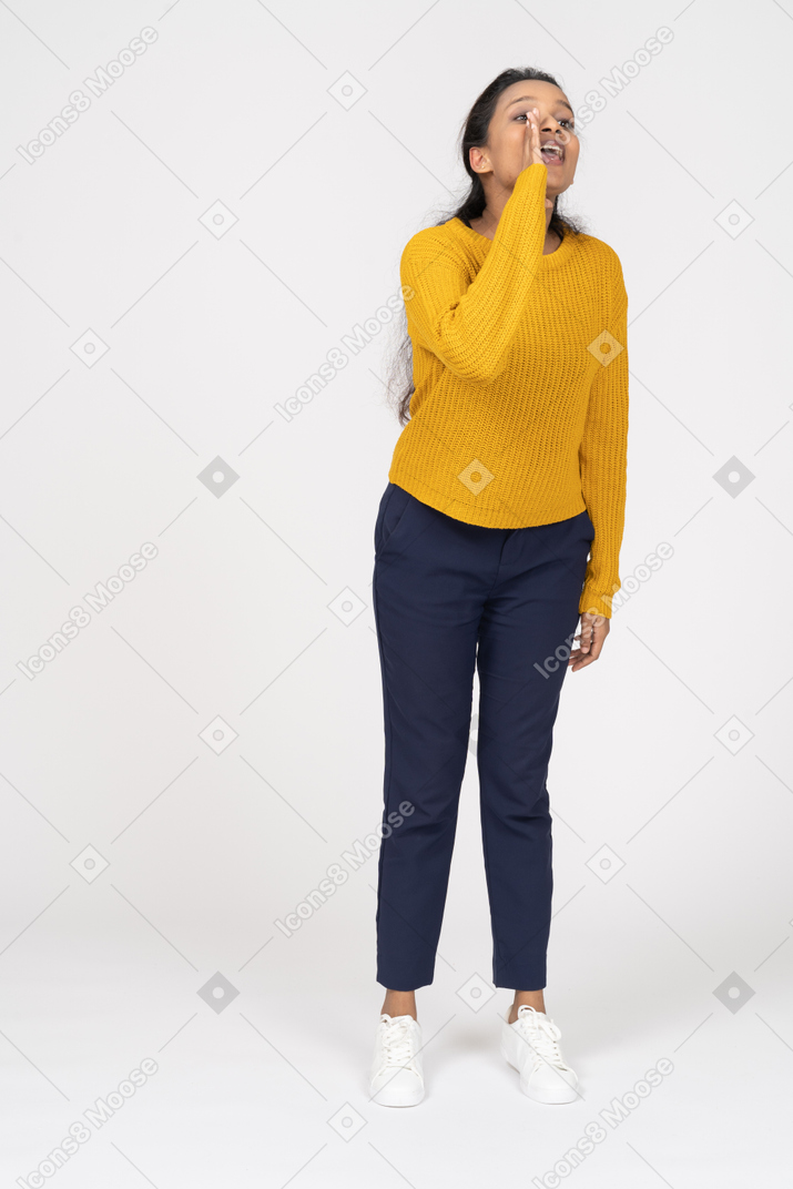 Front view of a girl in casual clothes calling someone